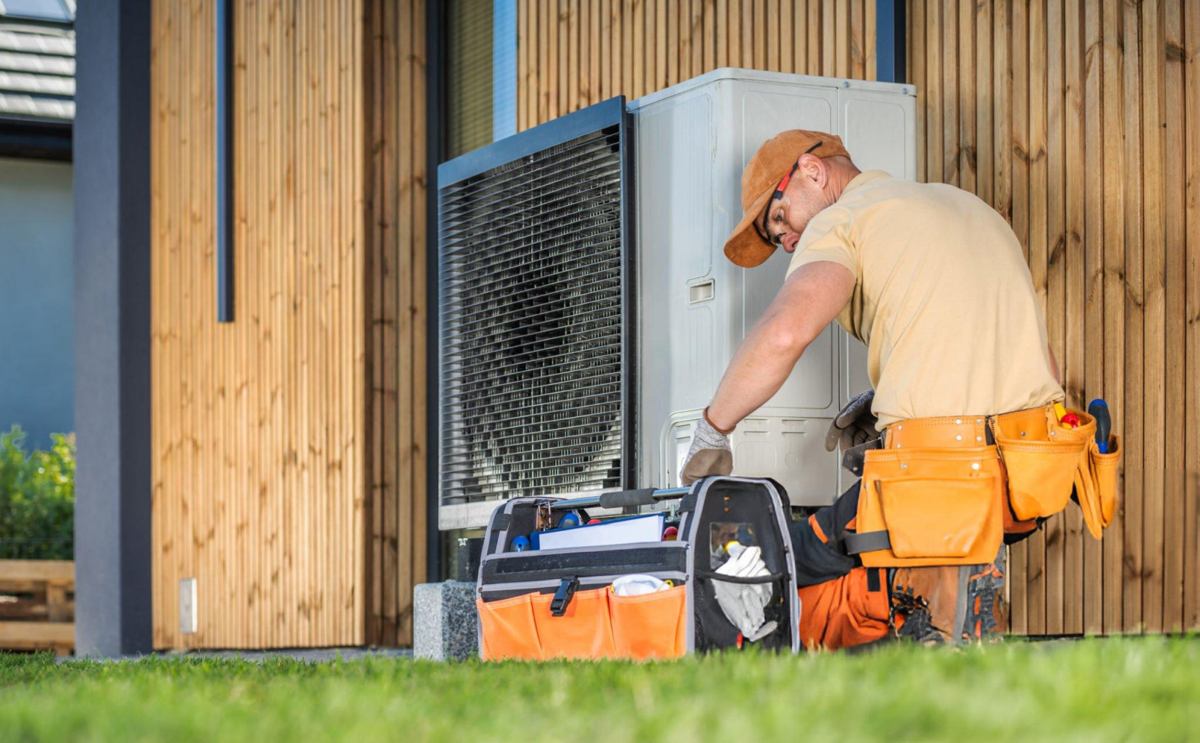 Worker Installing Heat Pump
